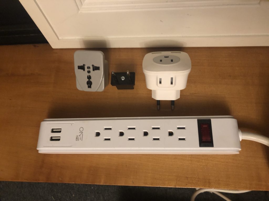 Pictures of my family's U.S. to Chile plug adapters.