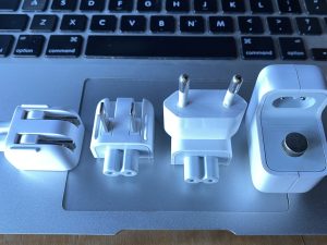 iPhone charger shown here with 1 type-C and 2 type-A inserts that can be swapped in and out of the iPhone/iPad and MacBook Chargers - the kit comes with 7 different world plug types and does not include a charger
