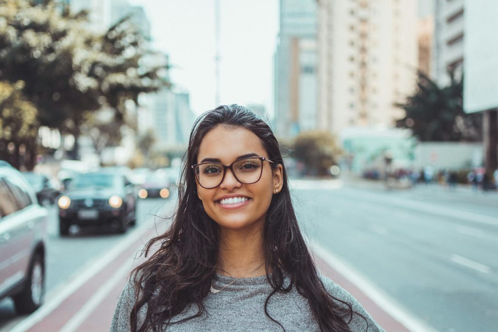 Woman Wearing Black Eyeglasses, representation of someone in Chile happy because they can buy power outlets in Chile.