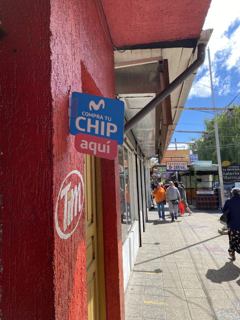 Sign outside of store in Chile advertising Movistar Prepaid SIM Cards