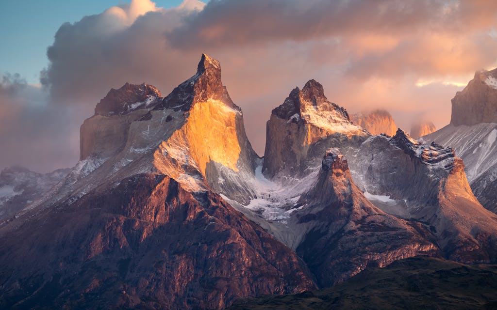 Breathtaking view of snowcapped mountains during sunset in Torres del Paine, Patagonia, Chile.